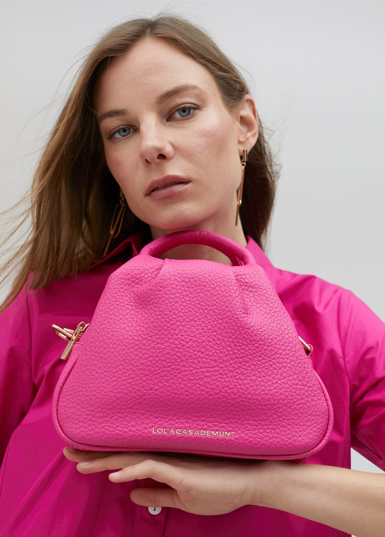 BOLSO BANDOLERA TRENZADA FUCSIA