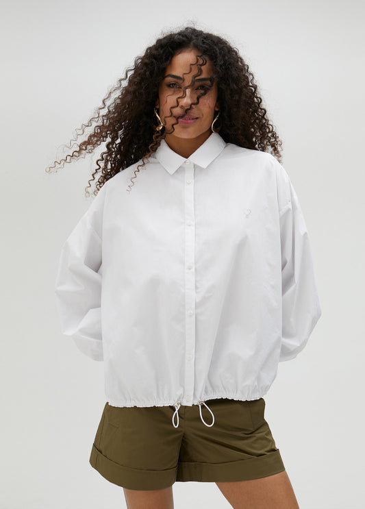 CAMISA POPELÍN CON GOMA EN BAJO